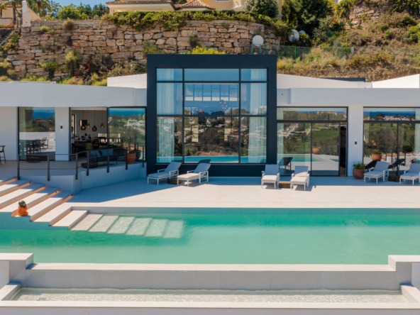 Villa Teva, a luxury rental villa in Marbella with panoramic sea and mountain views, private pool, and modern design.